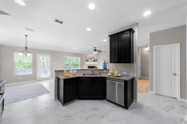 kitchen featuring marble finish floor, recessed lighting, open floor plan, dark cabinets, and dishwasher