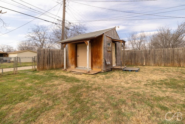 view of shed with a fenced backyard