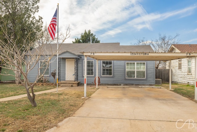 view of front of home featuring central AC unit, a front yard, and fence