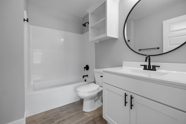 full bathroom with  shower combination, vanity, toilet, and wood finished floors