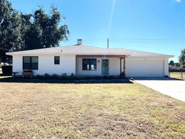 single story home with a garage, driveway, a front lawn, and a shingled roof