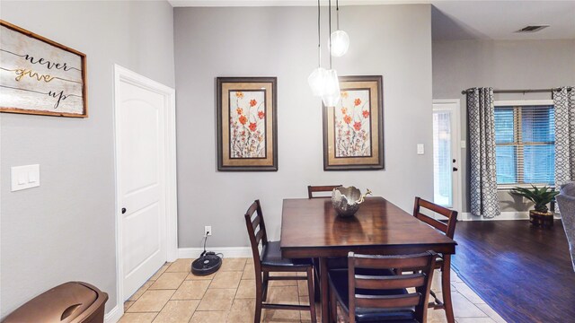 dining room with visible vents, baseboards, and light tile patterned floors