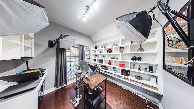 home office featuring lofted ceiling, baseboards, dark wood finished floors, and track lighting