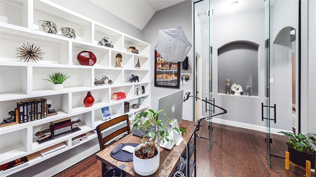 interior space with baseboards and dark wood-type flooring