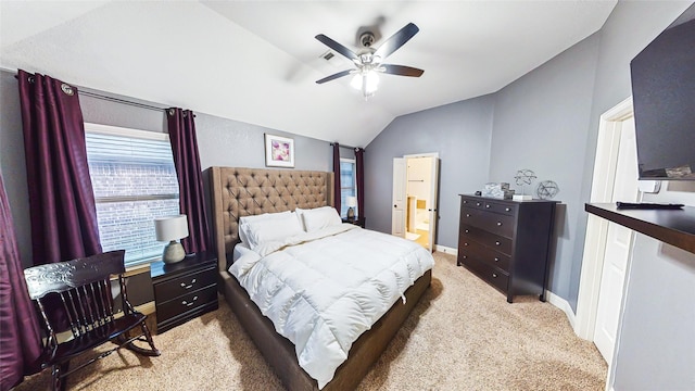 bedroom with light carpet, baseboards, connected bathroom, ceiling fan, and vaulted ceiling