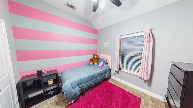 carpeted bedroom with vaulted ceiling, a ceiling fan, visible vents, and baseboards