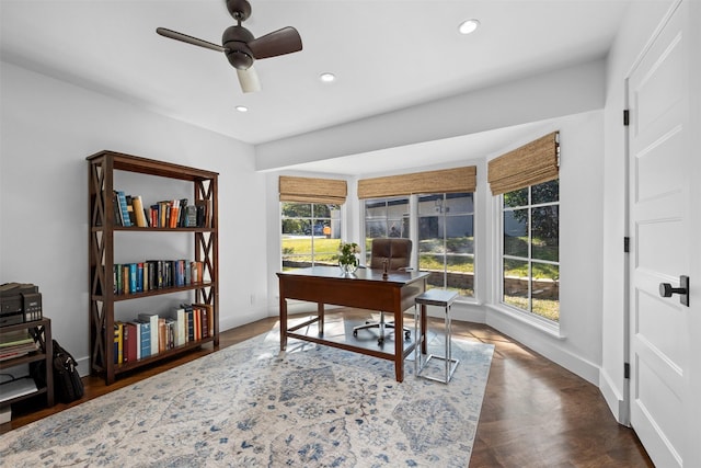 office space with a ceiling fan, recessed lighting, dark wood-style flooring, and baseboards