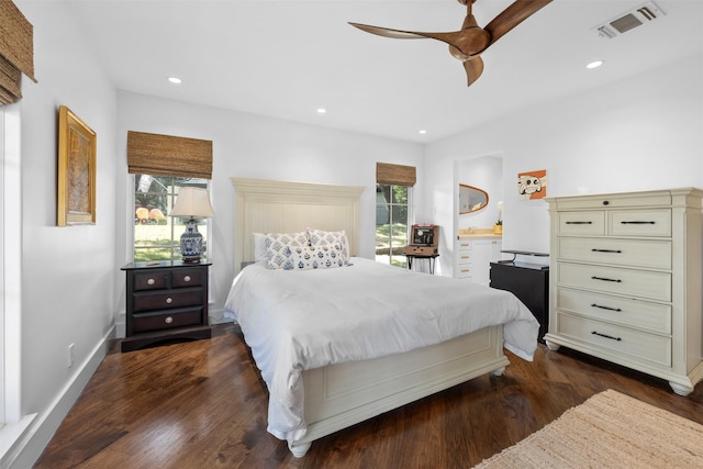 bedroom featuring ceiling fan, recessed lighting, visible vents, baseboards, and dark wood-style floors