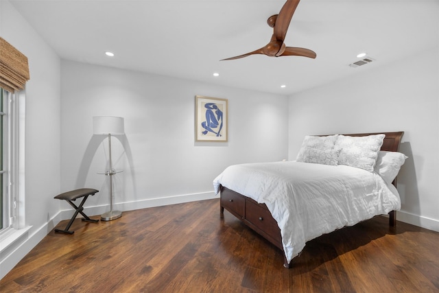 bedroom with dark wood-type flooring, recessed lighting, visible vents, and baseboards