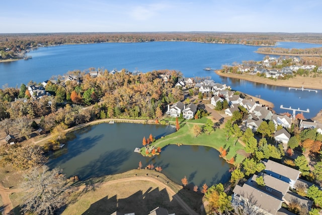 birds eye view of property with a water view and a residential view