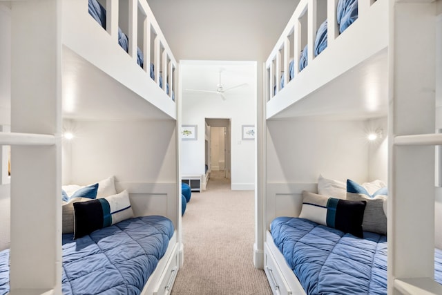 carpeted bedroom featuring baseboards