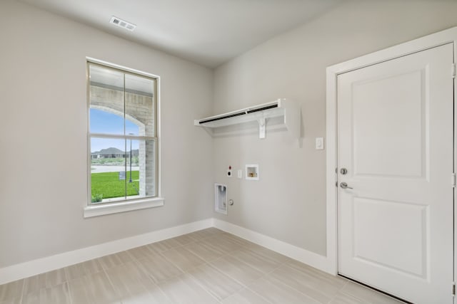 laundry room with laundry area, baseboards, visible vents, gas dryer hookup, and electric dryer hookup