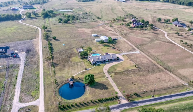 drone / aerial view with a water view and a rural view