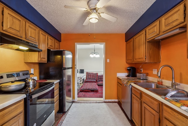 kitchen featuring brown cabinets, decorative light fixtures, stainless steel appliances, light countertops, and under cabinet range hood