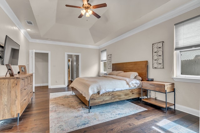 bedroom featuring baseboards, visible vents, dark wood-style flooring, and ornamental molding