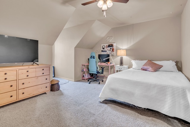 carpeted bedroom featuring lofted ceiling, a ceiling fan, and baseboards