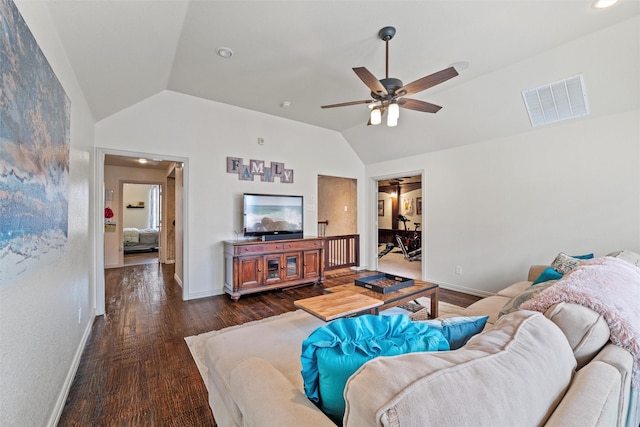 living area featuring lofted ceiling, visible vents, dark wood-type flooring, ceiling fan, and baseboards