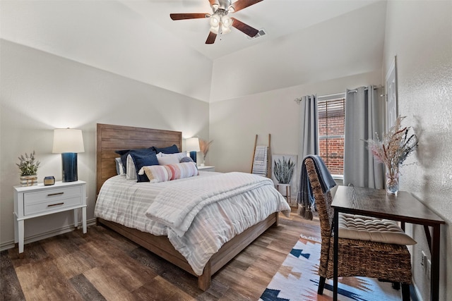 bedroom featuring vaulted ceiling, dark wood-style flooring, visible vents, and a ceiling fan