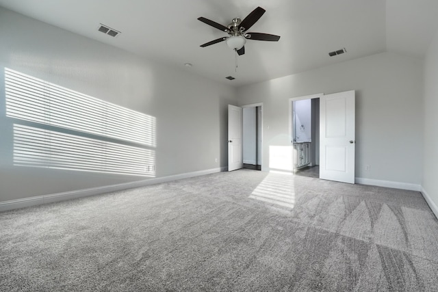 unfurnished bedroom featuring carpet, visible vents, and baseboards