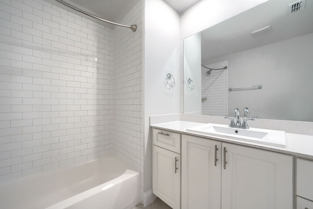 full bath featuring visible vents, tub / shower combination, and vanity