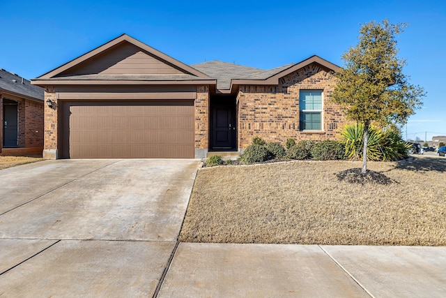 single story home with a garage, concrete driveway, and brick siding