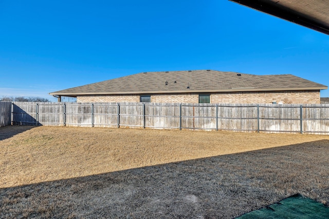 view of yard with a fenced backyard