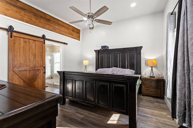 bedroom with dark wood-style floors, a barn door, a ceiling fan, and recessed lighting