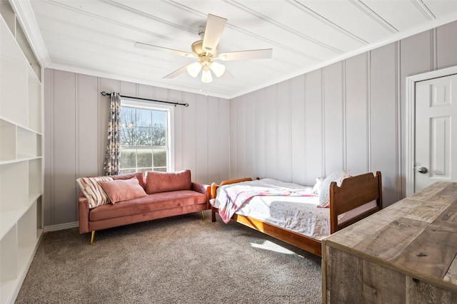 carpeted bedroom featuring ornamental molding and ceiling fan