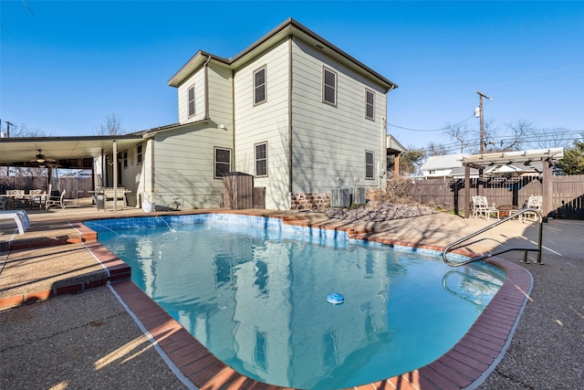 view of swimming pool with a fenced in pool, a patio, central AC unit, fence, and a pergola