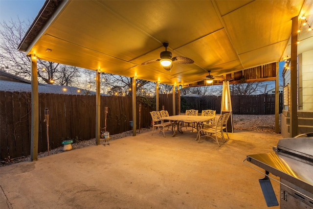 view of patio / terrace with ceiling fan, outdoor dining space, and a fenced backyard