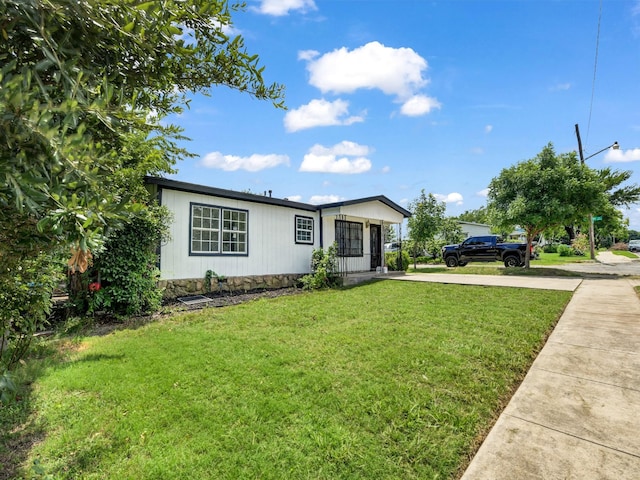 view of front of home featuring crawl space, a front lawn, and concrete driveway