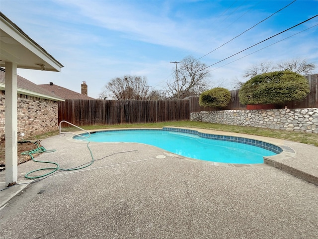 view of swimming pool featuring a patio, a fenced backyard, and a fenced in pool