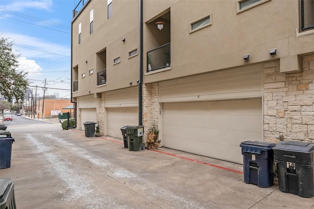 exterior space featuring an attached garage and concrete driveway