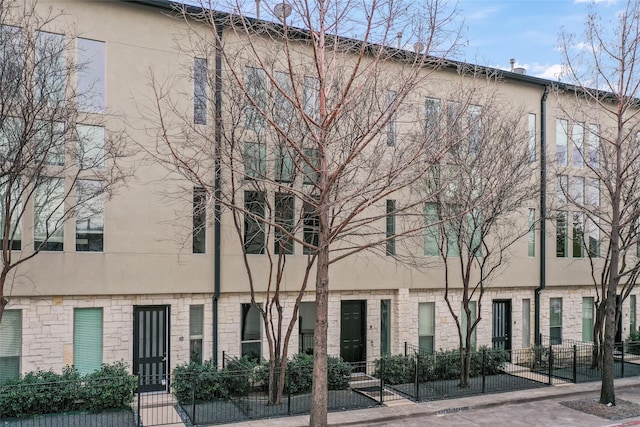 view of property with a fenced front yard