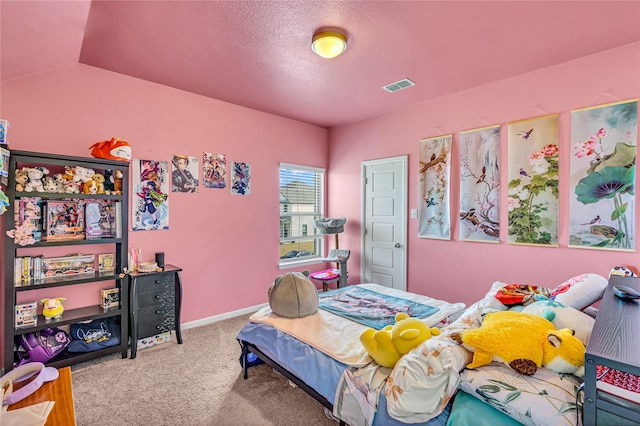 bedroom featuring baseboards, carpet, visible vents, and a textured ceiling