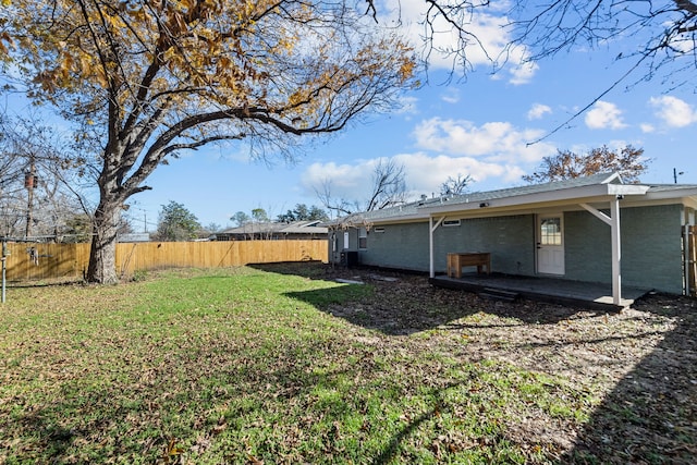 view of yard with a fenced backyard and a patio