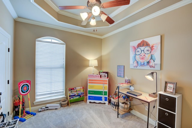 recreation room featuring a raised ceiling, ornamental molding, carpet flooring, and a healthy amount of sunlight