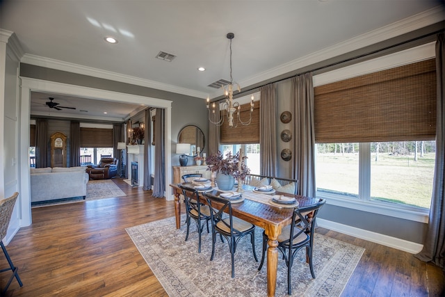 1188 An County Road 103, Elkhart, TX 75839 - dining room with a chandelier, healthy amount of natural light, ornamental molding, wood finished floors, and recessed lighting