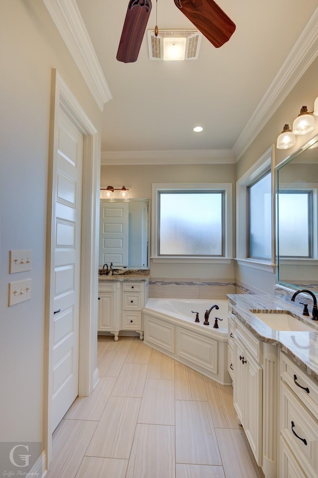 bathroom with crown molding, visible vents, ceiling fan, vanity, and a bath