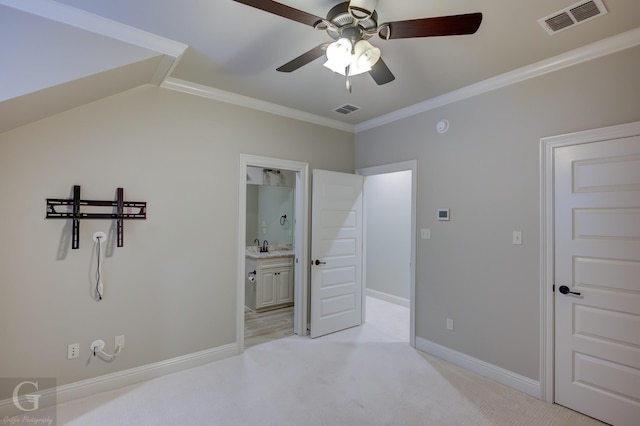 bedroom featuring light colored carpet, visible vents, crown molding, and baseboards