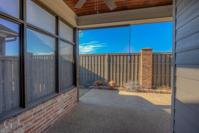 view of patio featuring fence and a ceiling fan