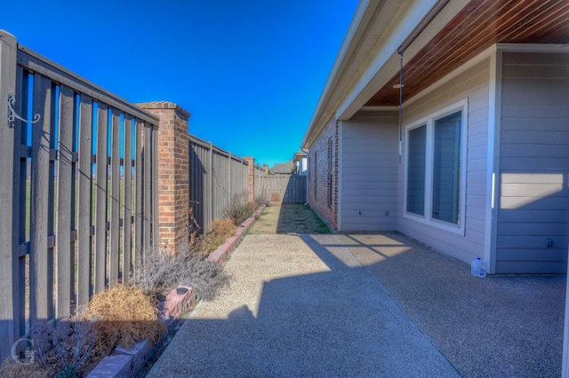 view of yard with a fenced backyard and a patio