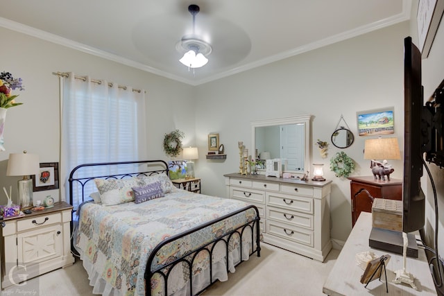 bedroom with ornamental molding and ceiling fan