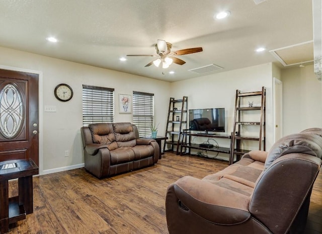 living room with dark wood finished floors, recessed lighting, visible vents, attic access, and ceiling fan