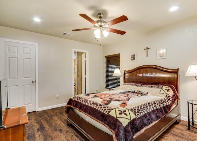 bedroom featuring dark wood-type flooring, visible vents, and baseboards