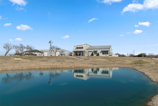 rear view of property with a water view