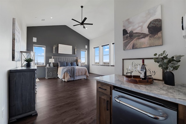 bedroom featuring lofted ceiling, dark wood-style floors, and a ceiling fan