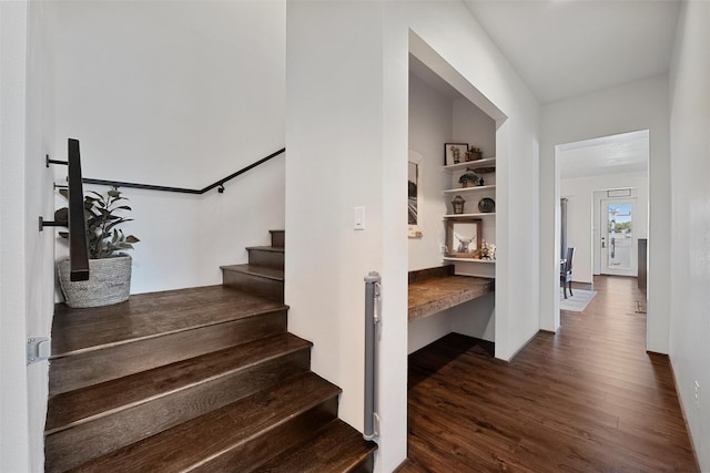 stairway featuring wood finished floors