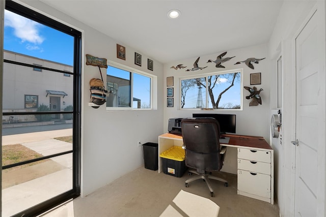 office space with concrete flooring