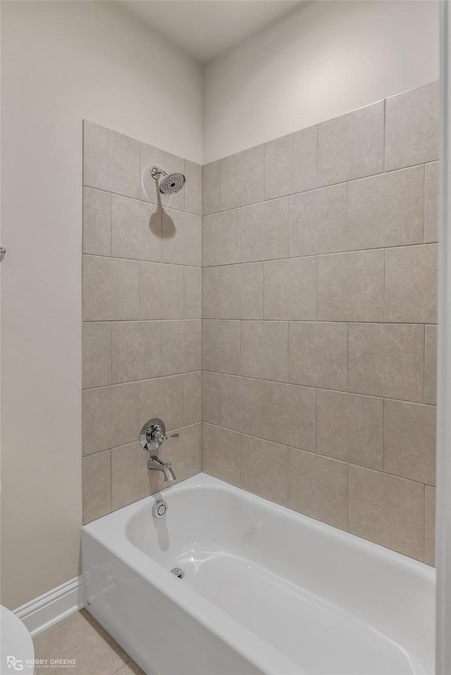 full bathroom featuring toilet, shower / tub combination, baseboards, and tile patterned floors